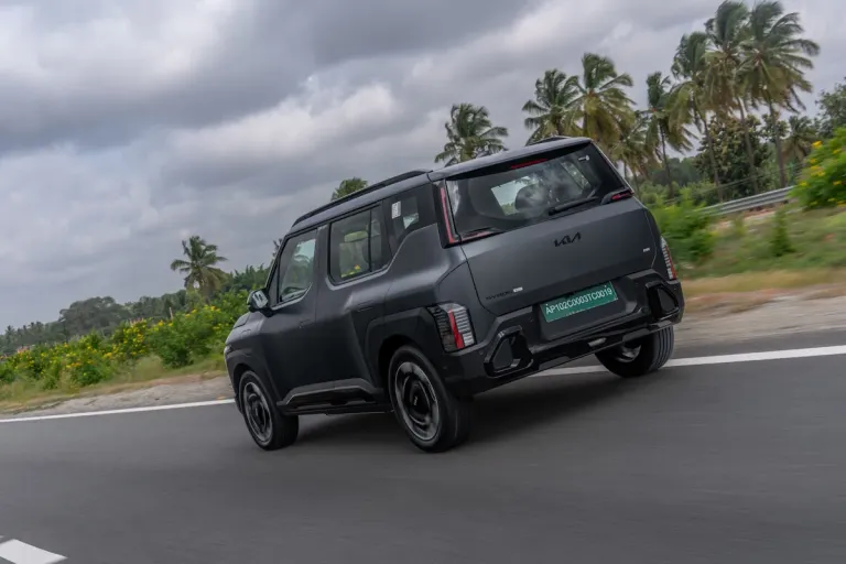 2026 kia syros ev rear motion shot.jpg